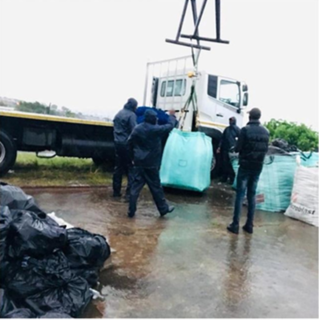Skotane Trading team loading recyclable materials onto a truck in Nquthu